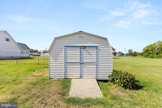 view of outdoor structure featuring a yard