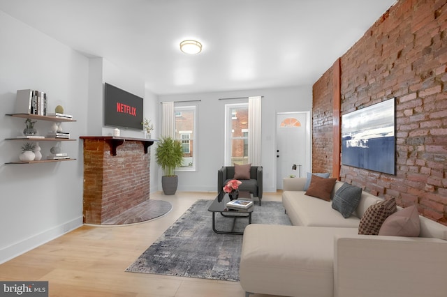 living room with baseboards and wood finished floors