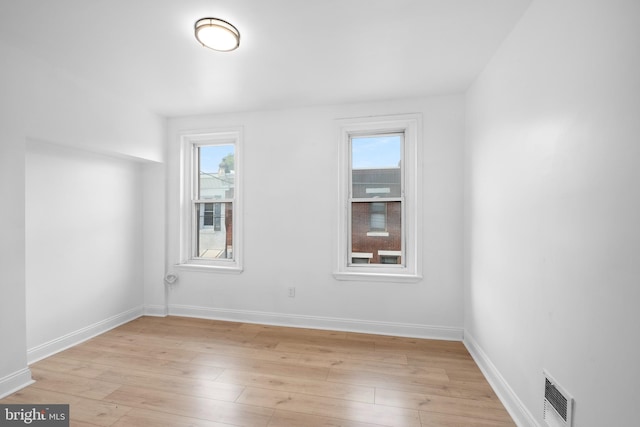 empty room with light wood-type flooring