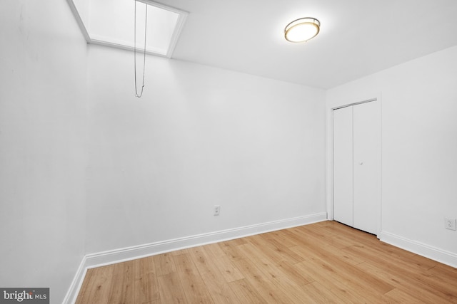 spare room featuring light wood-type flooring