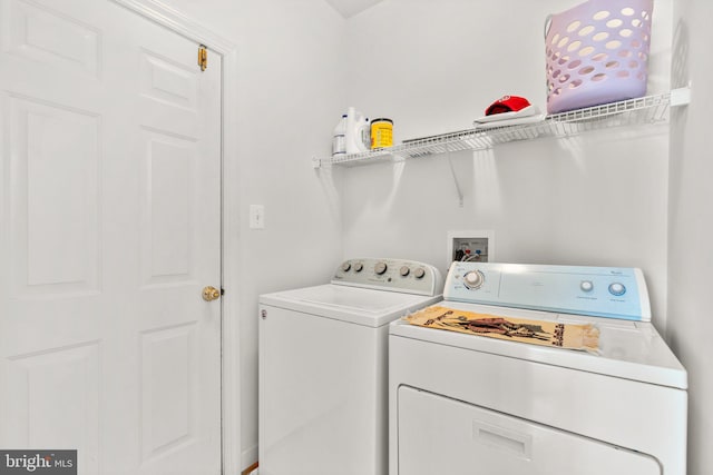 washroom with washer and dryer