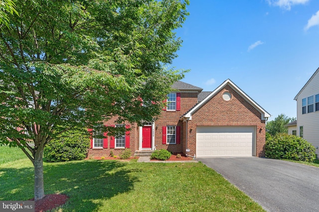 view of front of property with a front lawn and a garage