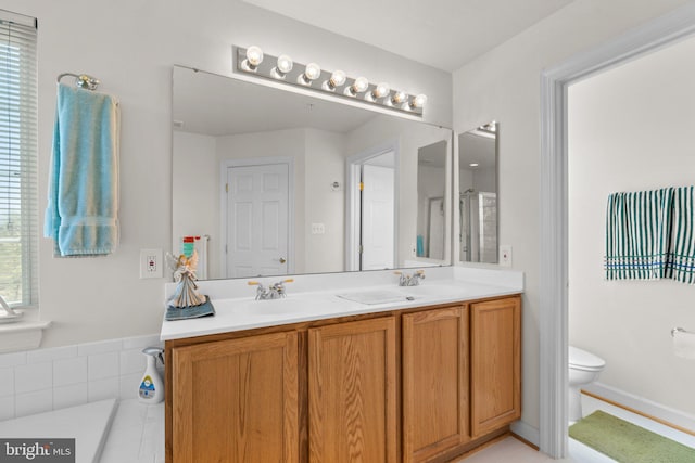 bathroom with tile patterned floors, toilet, and vanity