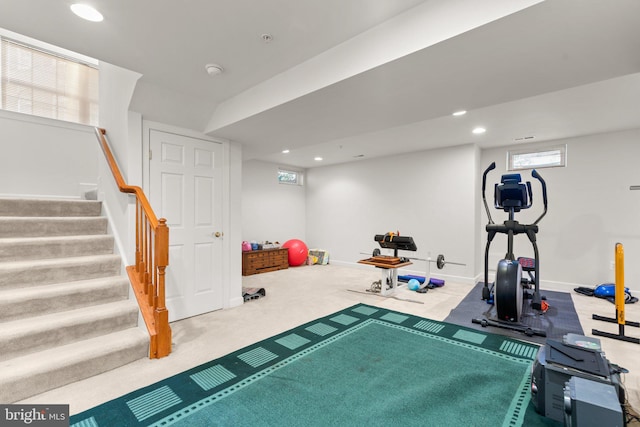 workout area featuring a wealth of natural light and carpet flooring