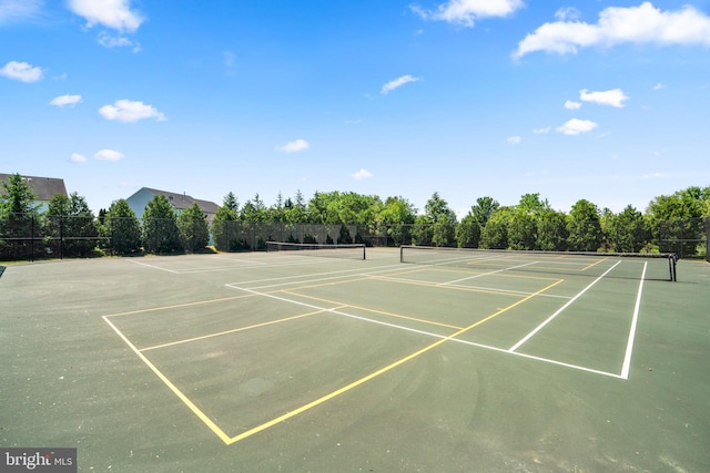 view of sport court with basketball hoop