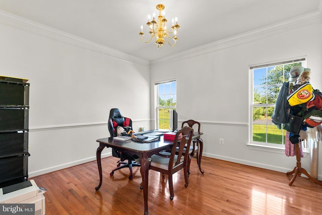 dining room featuring a wealth of natural light, a notable chandelier, and wood-type flooring