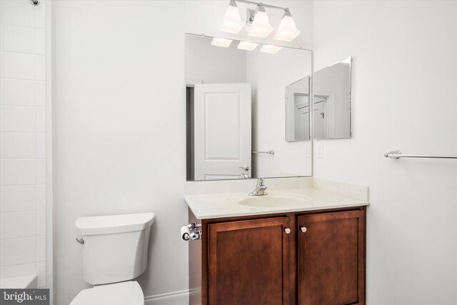 full bathroom featuring a bath, a shower, toilet, and vanity