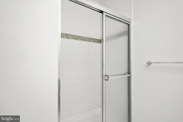 bathroom with a stall shower