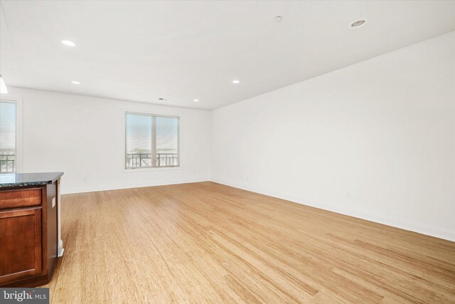 unfurnished living room featuring recessed lighting and light wood-type flooring