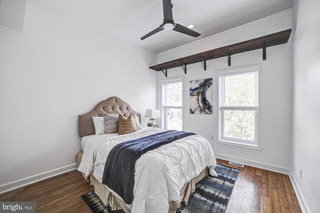 bedroom featuring ceiling fan and dark wood-type flooring