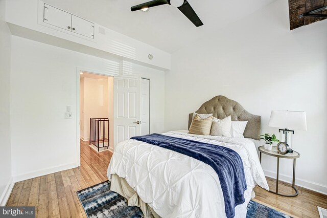 bedroom with wood-type flooring and ceiling fan