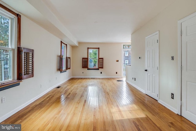 unfurnished room with light hardwood / wood-style flooring