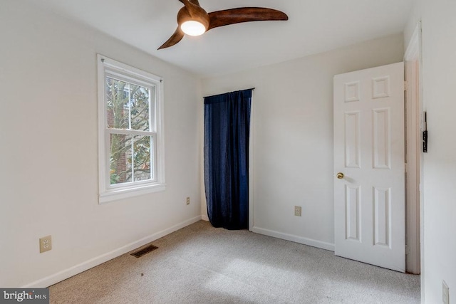 unfurnished bedroom featuring ceiling fan and carpet flooring