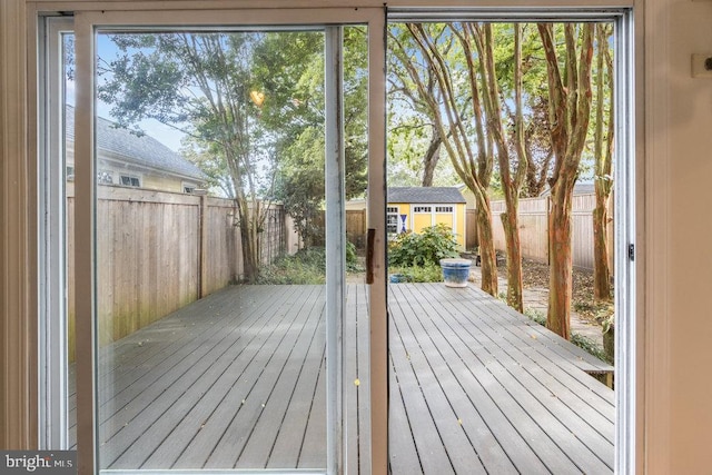 wooden deck with a storage unit