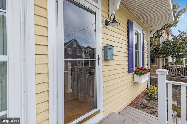 doorway to property featuring covered porch