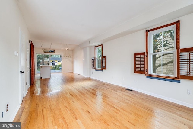 unfurnished living room featuring light hardwood / wood-style flooring