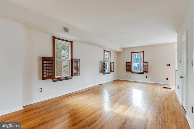 unfurnished living room featuring light wood-type flooring