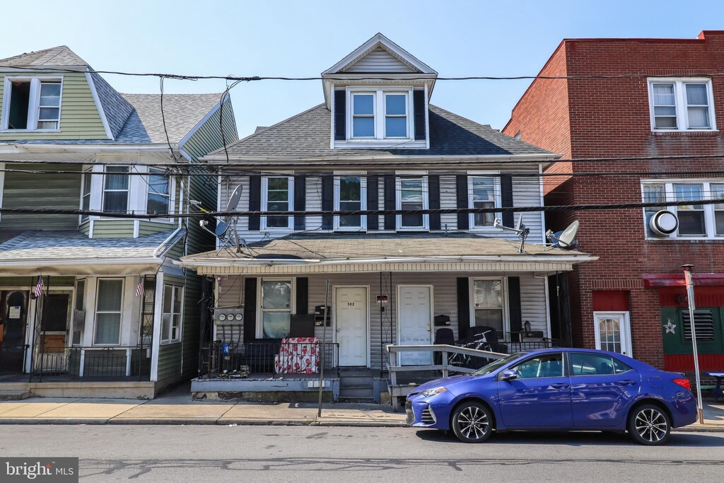 multi unit property featuring a porch