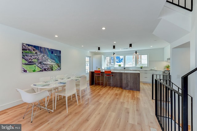 dining space featuring light hardwood / wood-style flooring