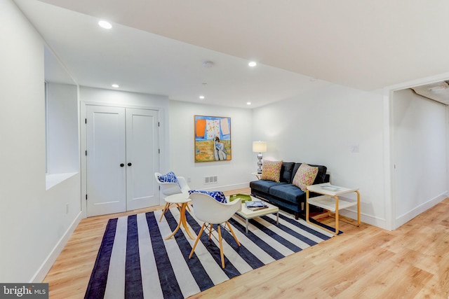 sitting room featuring light hardwood / wood-style flooring