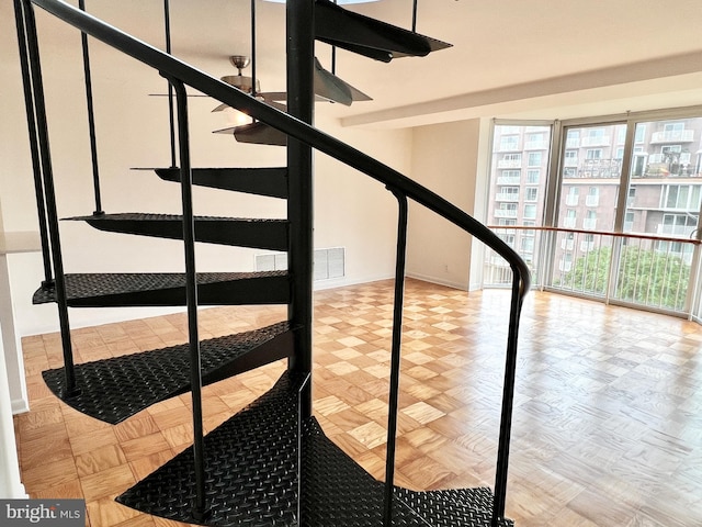 stairway with parquet flooring