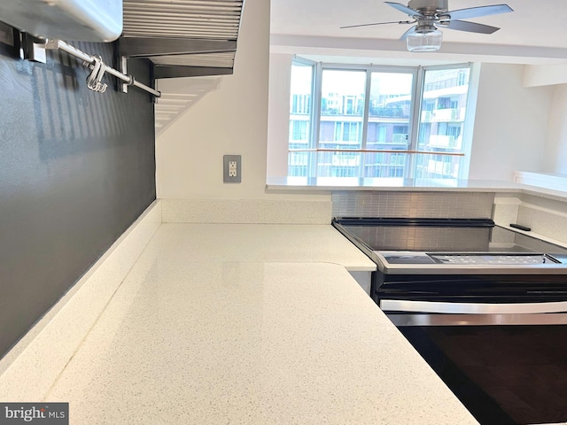 kitchen featuring ceiling fan and stainless steel electric range oven