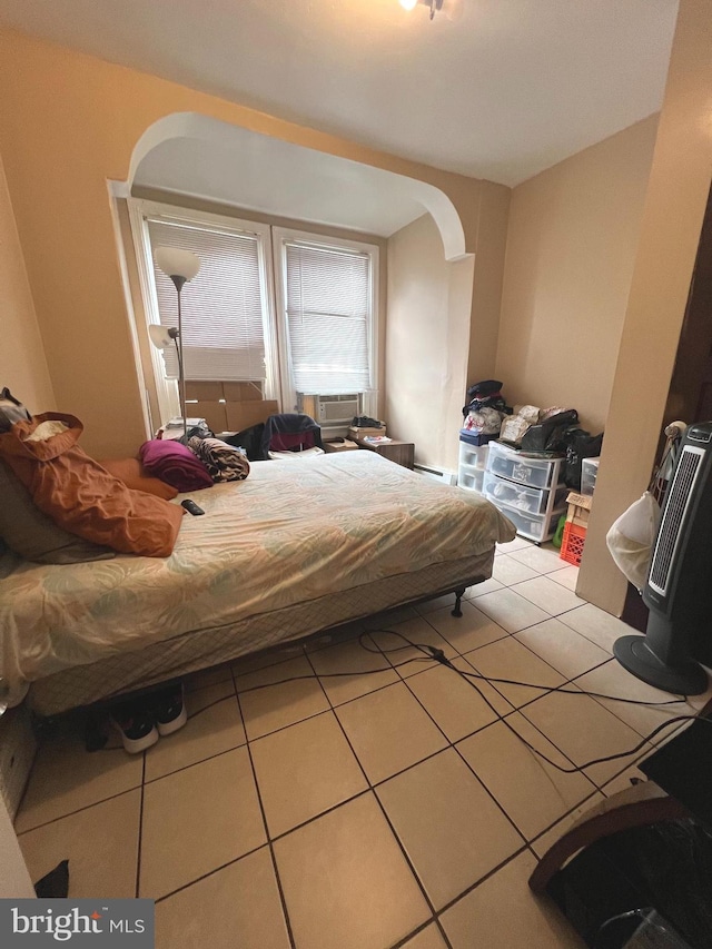 bedroom with light tile patterned floors