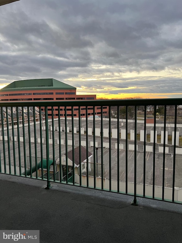 view of balcony at dusk