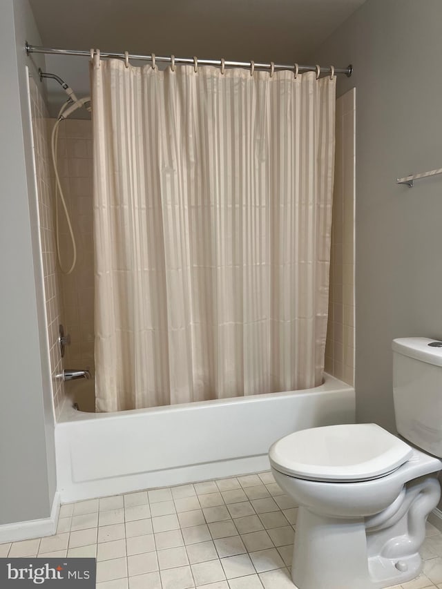 bathroom with tile patterned flooring, toilet, and shower / bathtub combination with curtain