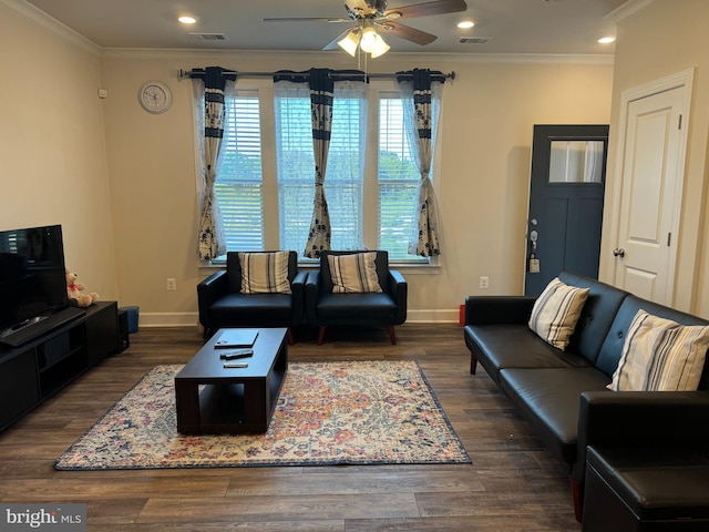 living room featuring ceiling fan, dark hardwood / wood-style floors, and crown molding