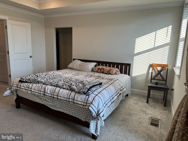 bedroom featuring ornamental molding and light colored carpet