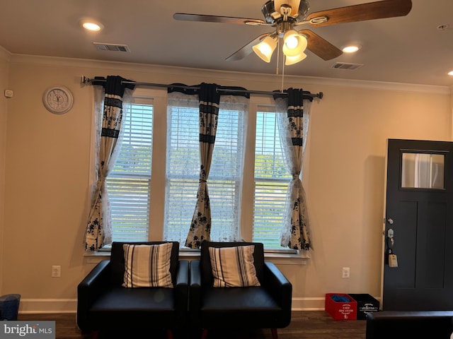 sitting room with crown molding, ceiling fan, and hardwood / wood-style floors