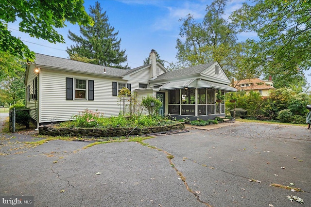 view of front of home with a sunroom