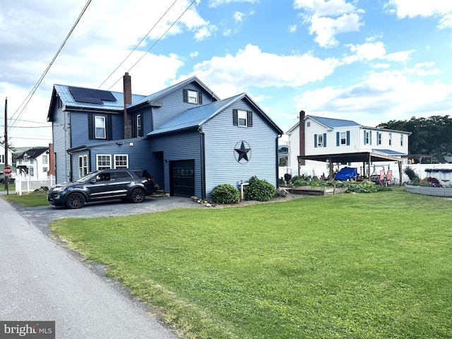 front facade with a garage and a front yard