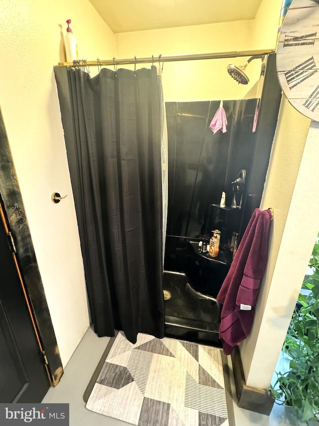 bathroom featuring walk in shower