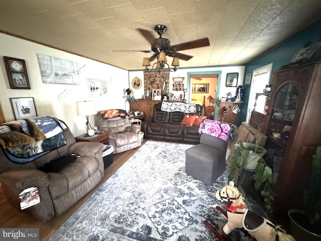 living room with dark wood-type flooring and ceiling fan