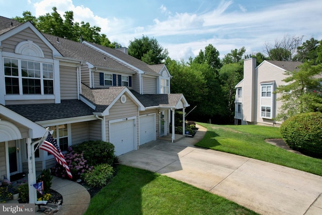 view of side of property with a garage and a lawn