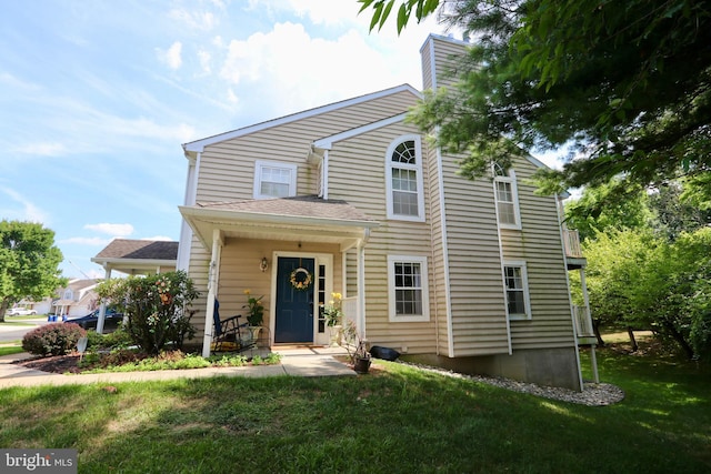 front facade with a front yard