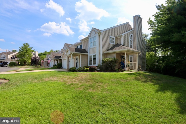 view of property featuring a front lawn