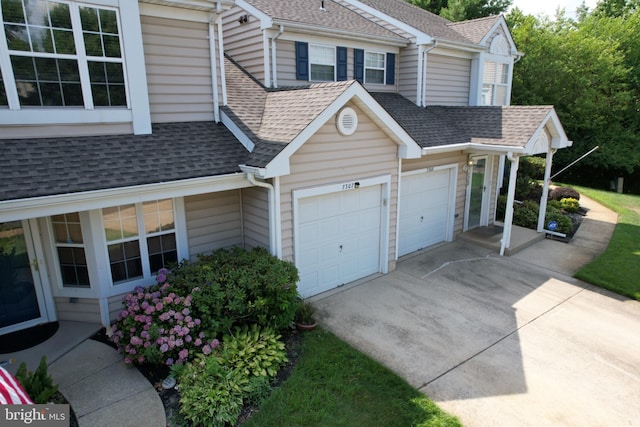 view of side of property with a garage