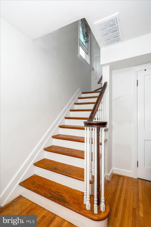 stairway with wood-type flooring