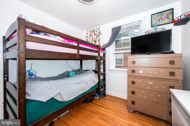 bedroom with light wood-type flooring