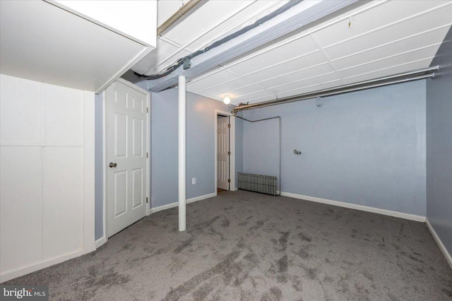 basement with carpet and radiator heating unit