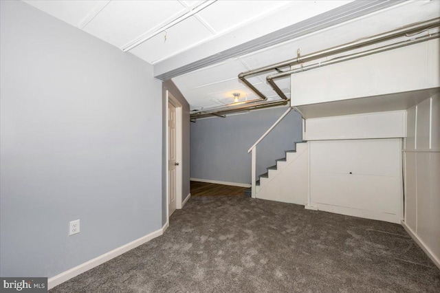 basement with dark carpet