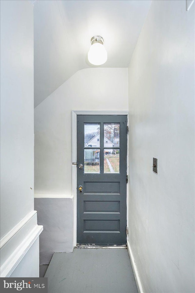 entryway featuring vaulted ceiling