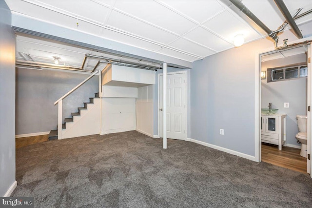 basement with dark carpet