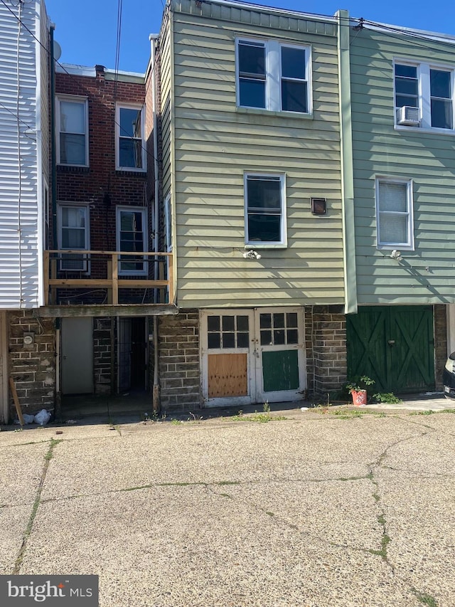 back of house with a garage