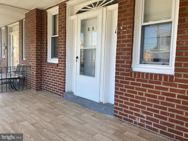 doorway to property with covered porch