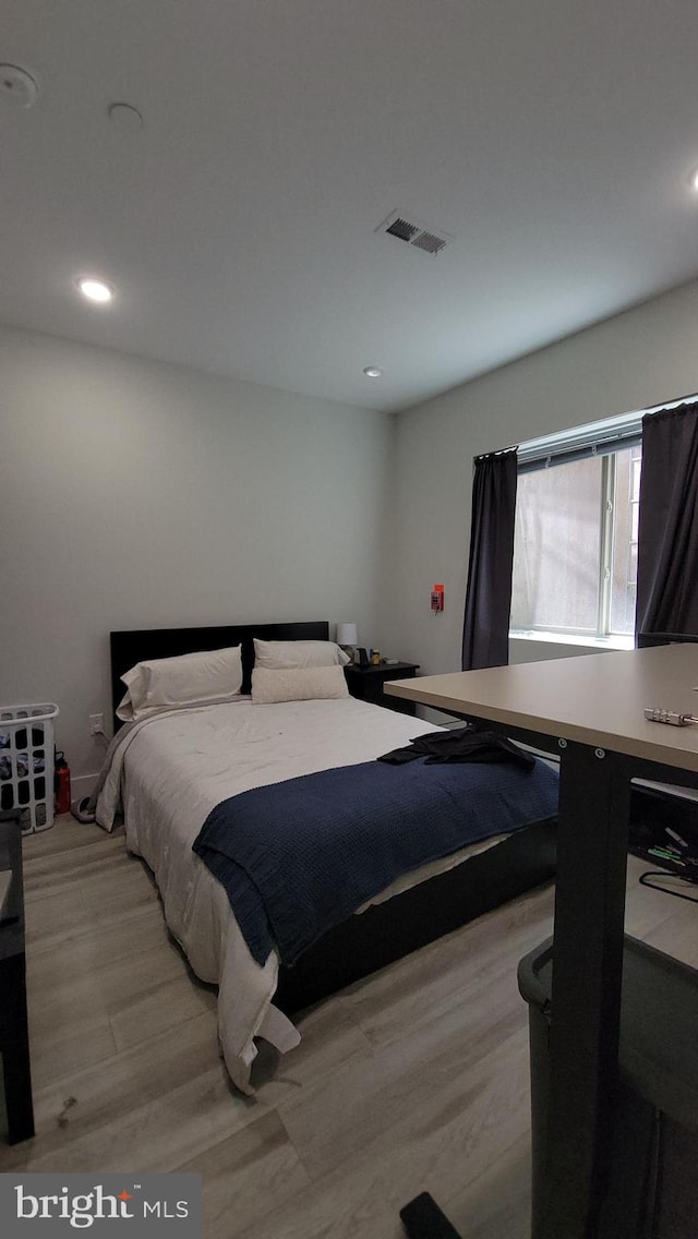 bedroom with light hardwood / wood-style floors