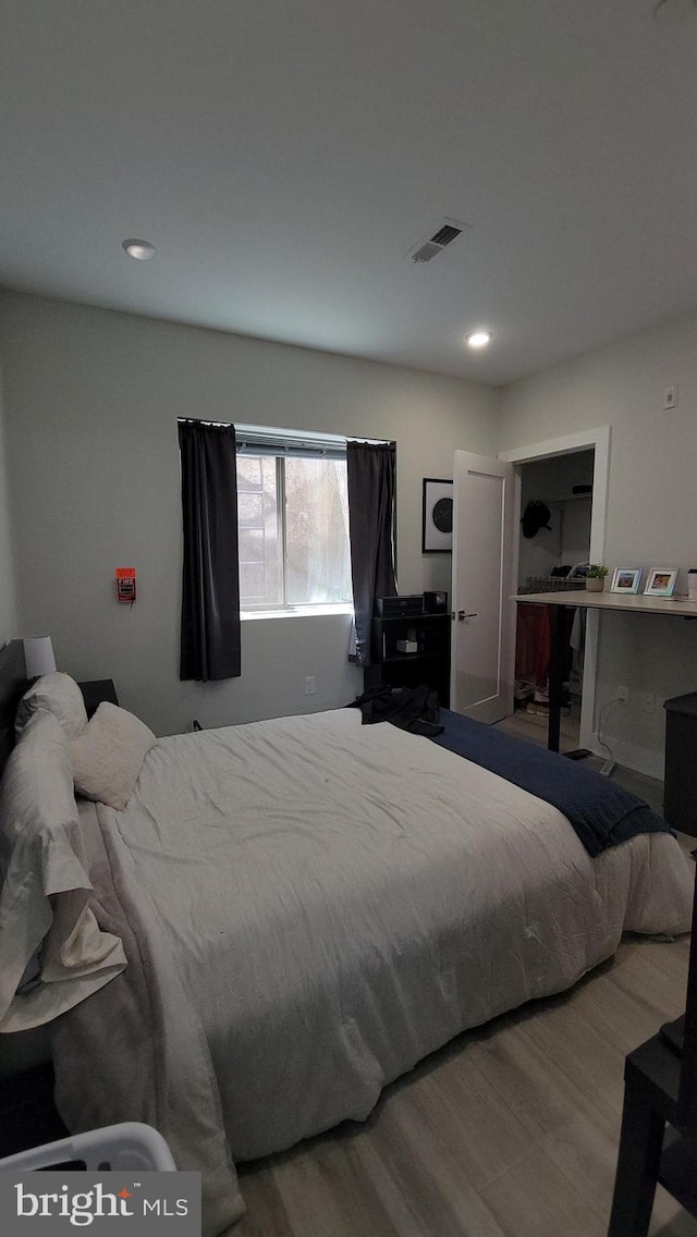 bedroom featuring hardwood / wood-style flooring